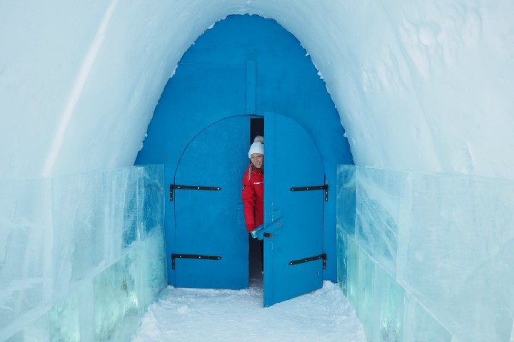 image of woman coming out of ice house